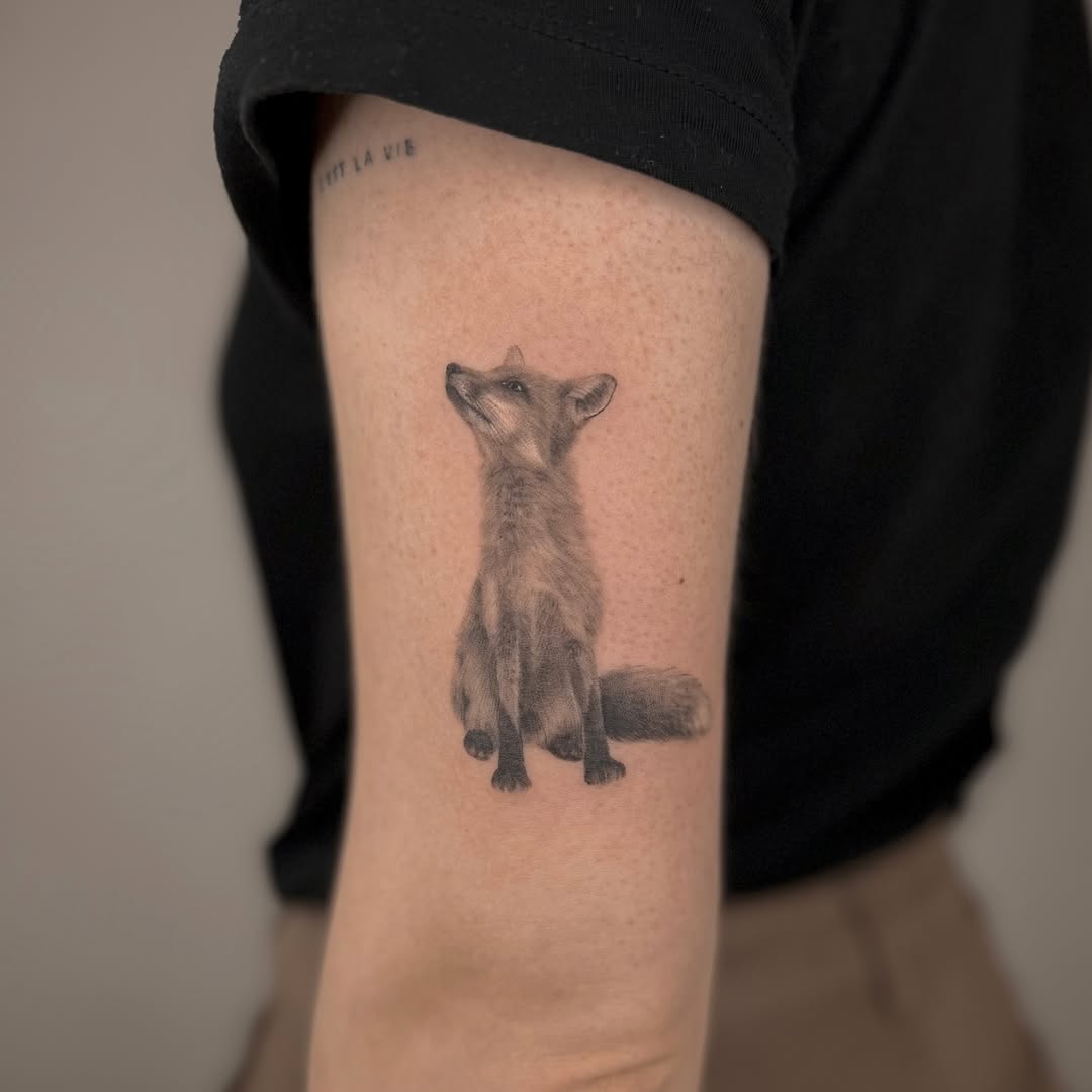 Stunning hyper-realistic fox tattoo on arm