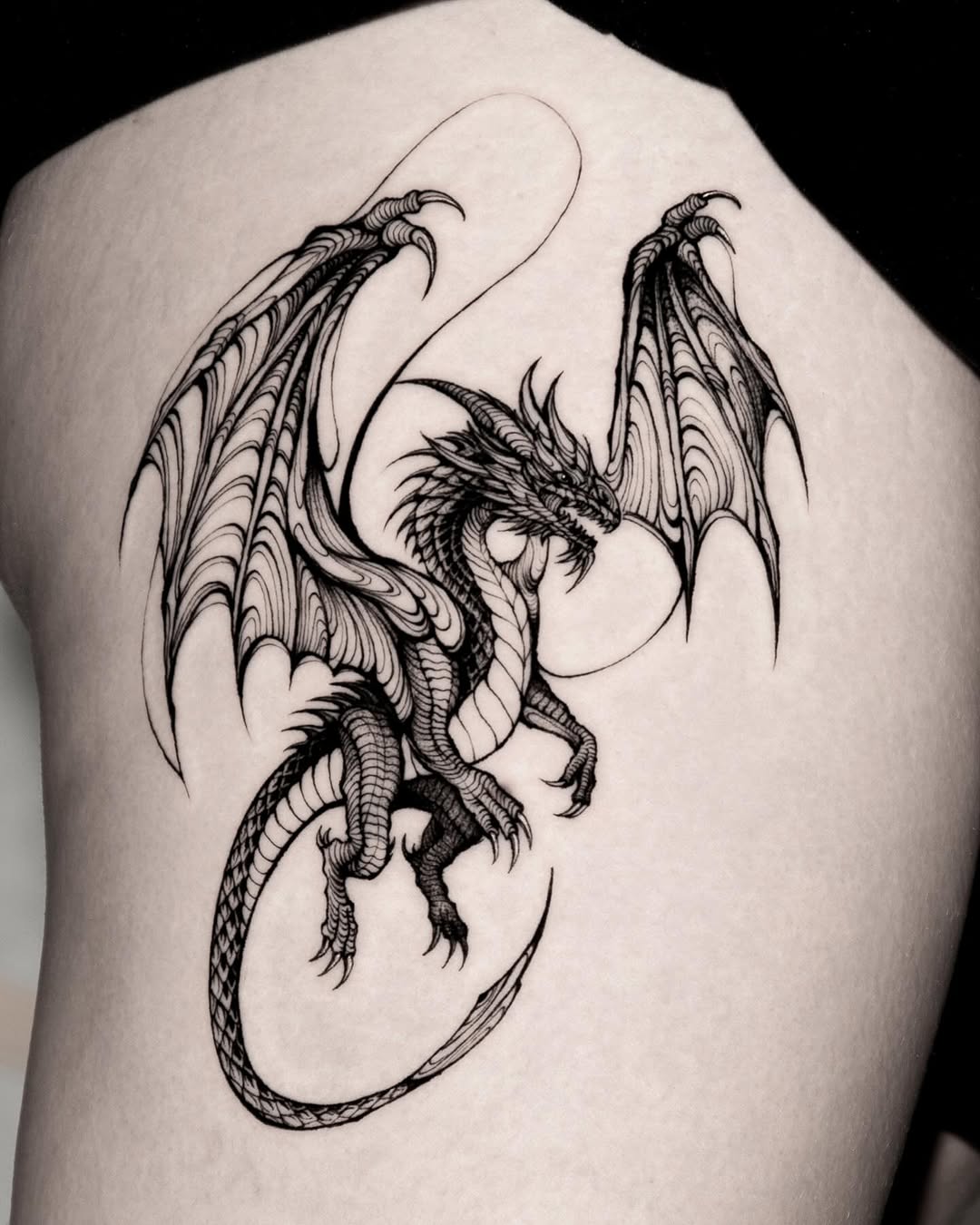 Bold black and white dragon tattoo design