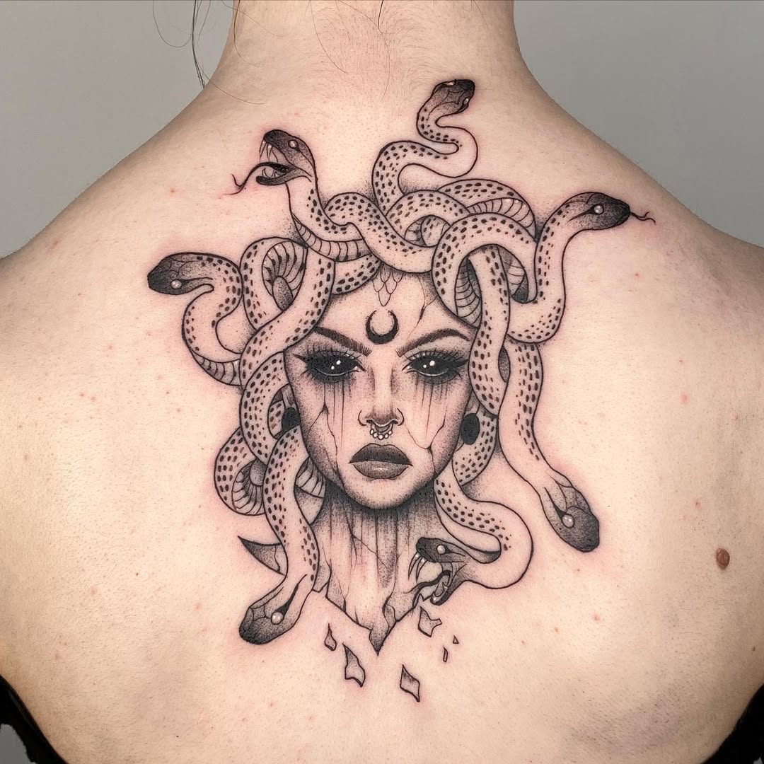 Striking Medusa Tattoo with Detailed Snakes