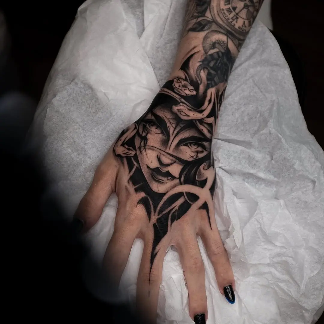 Striking Medusa Hand Tattoo with Intricate Details
