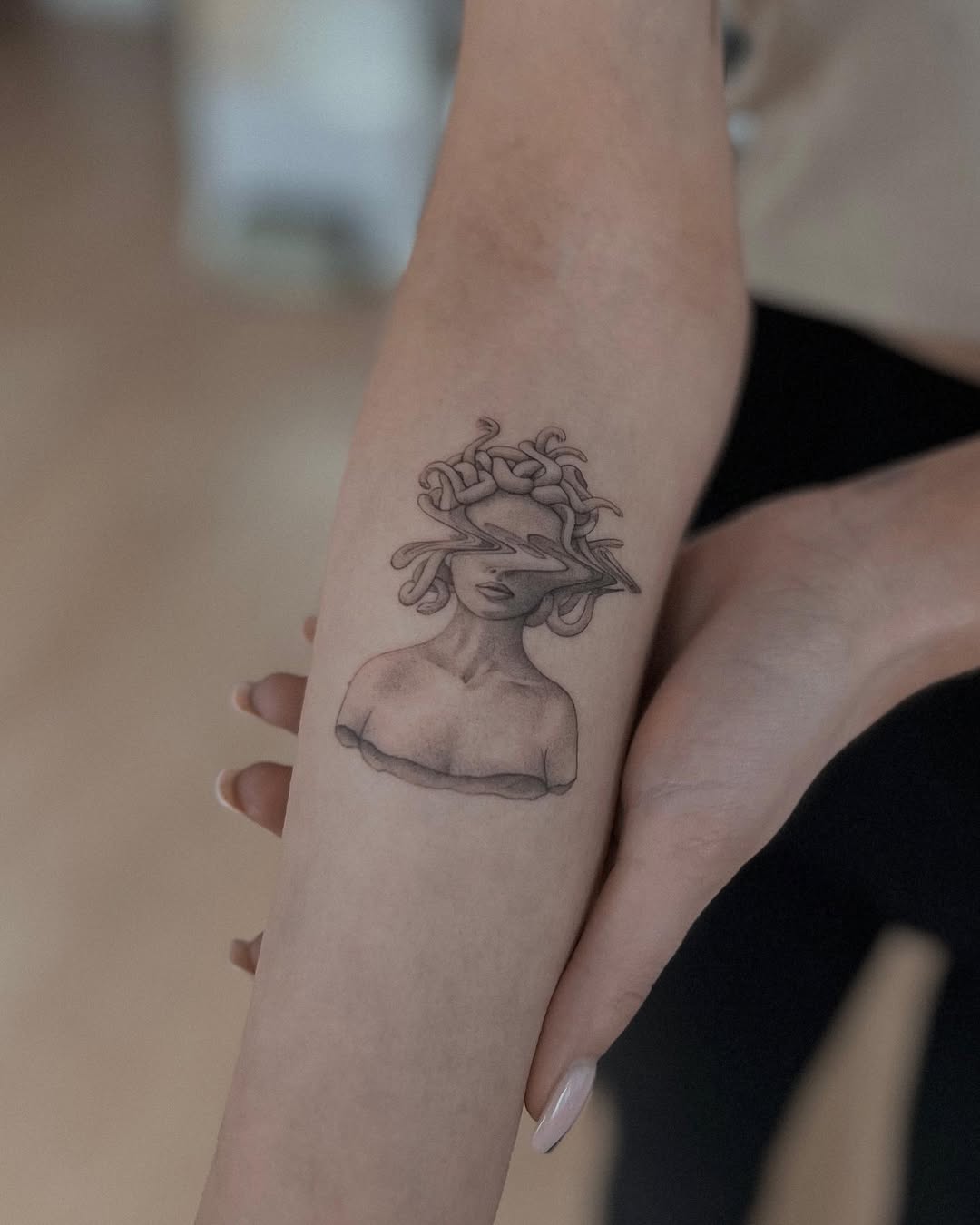 Striking Medusa Tattoo with Stylish Elements