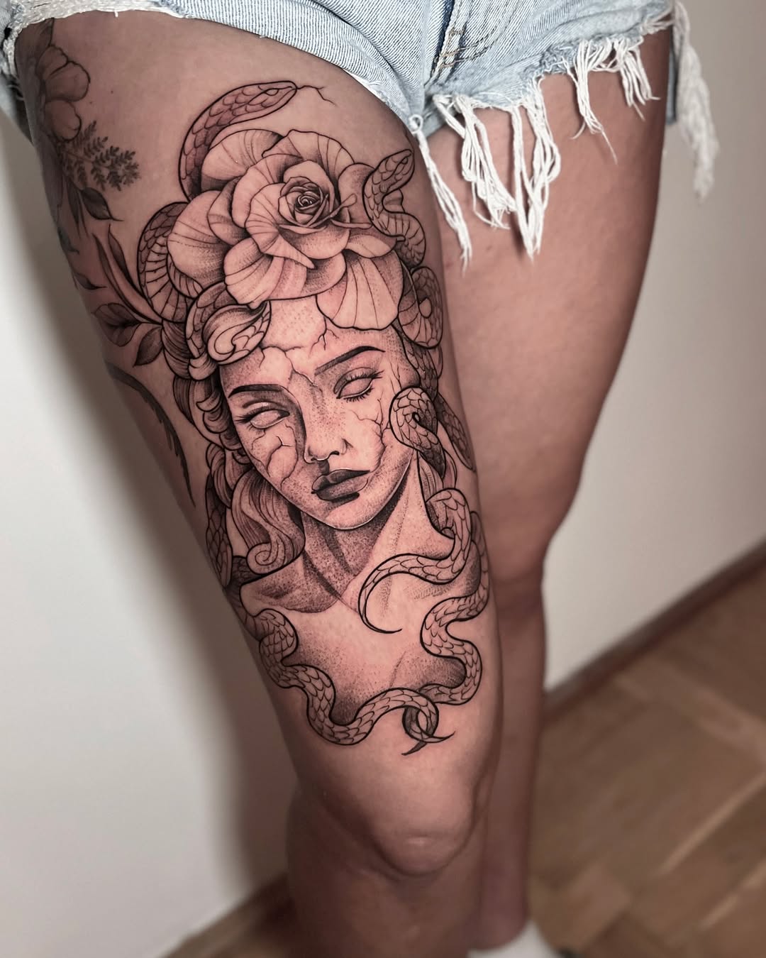 Intricate Medusa Tattoo with Floral Elements