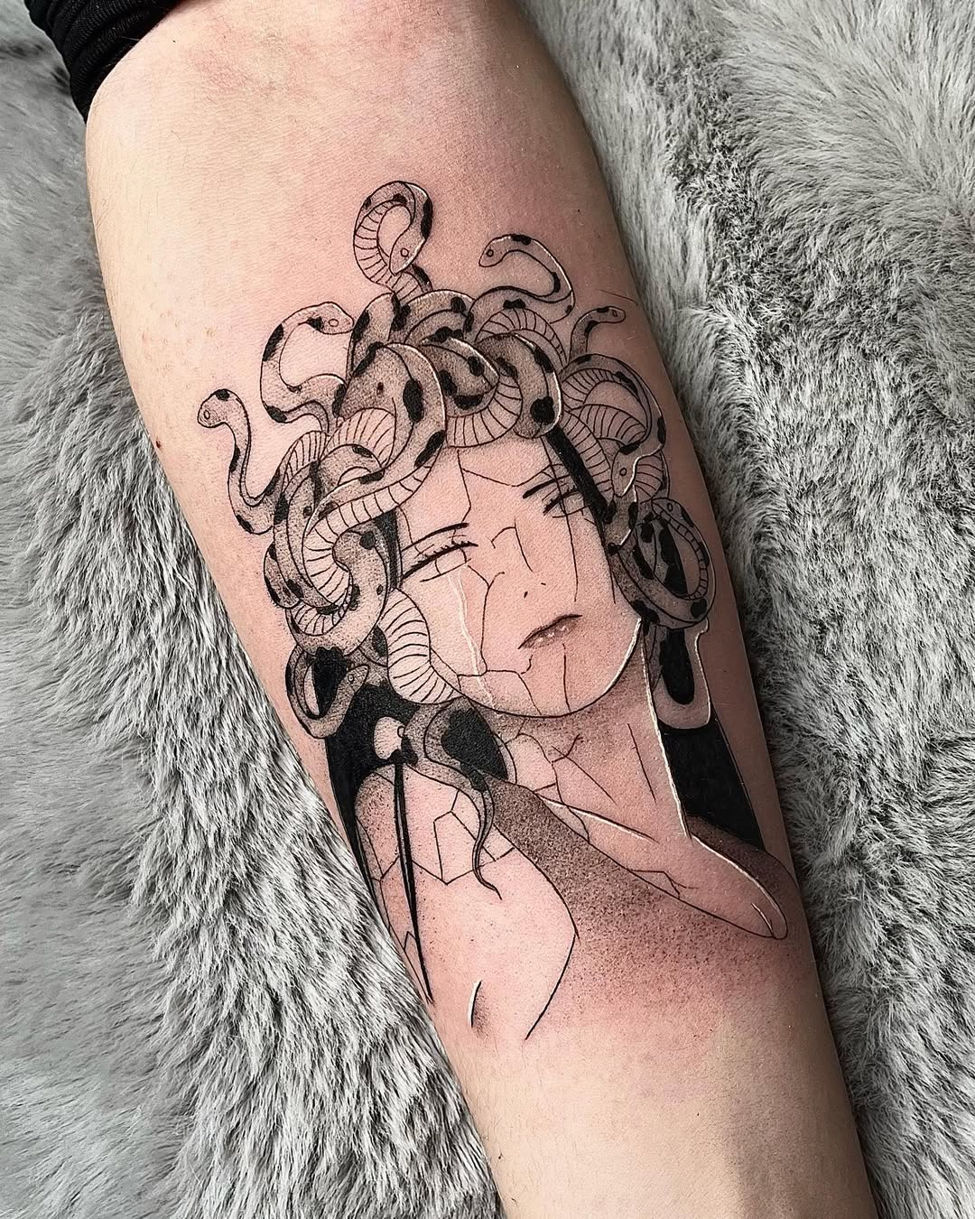 Artistic Medusa tattoo with snake details