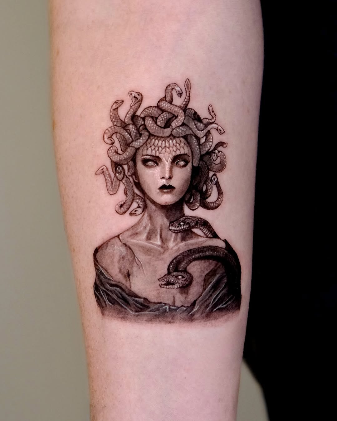 Striking Medusa Tattoo with Serpentine Detail