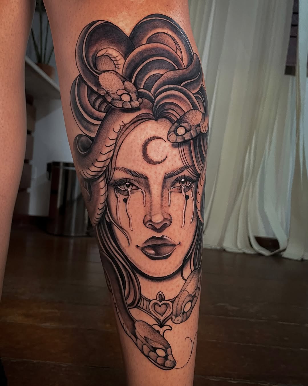 Striking Medusa Leg Tattoo with Mystical Elements