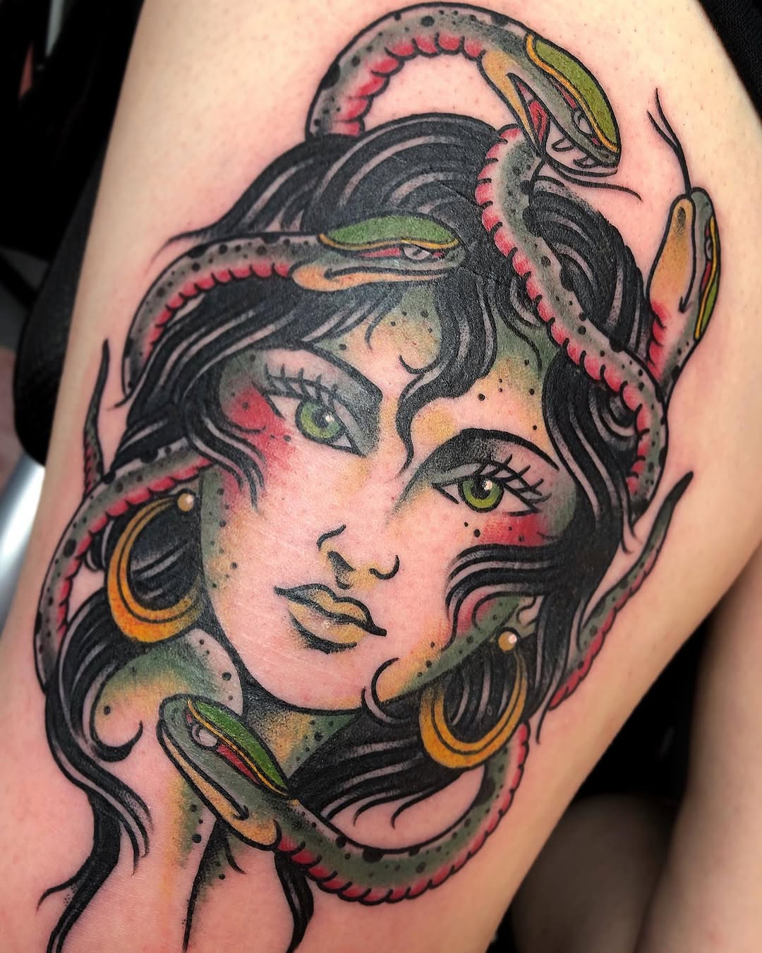 Striking medusa tattoo with snake details