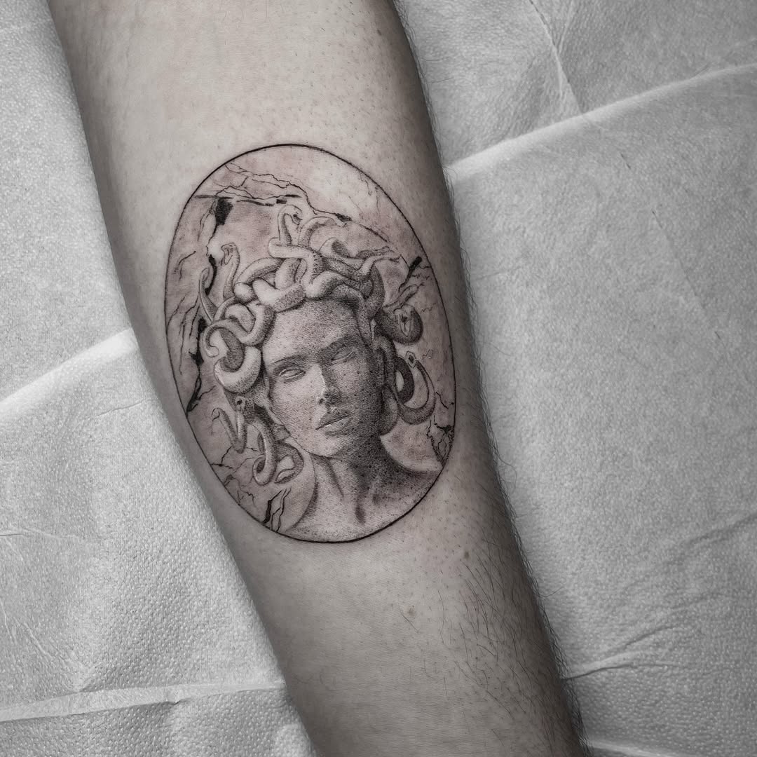 Intricate Medusa tattoo in black and gray