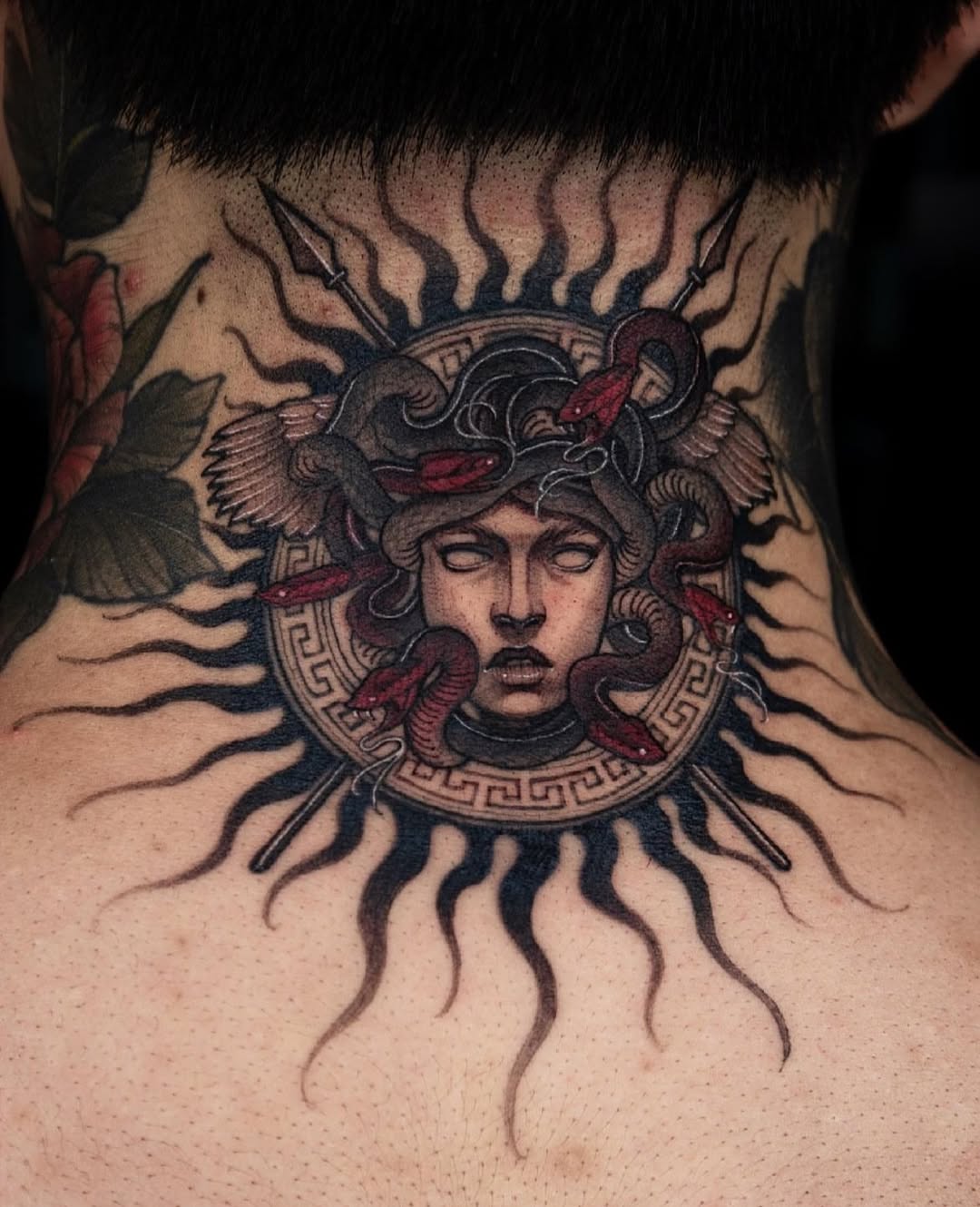 Striking Medusa Tattoo with Sun Motif