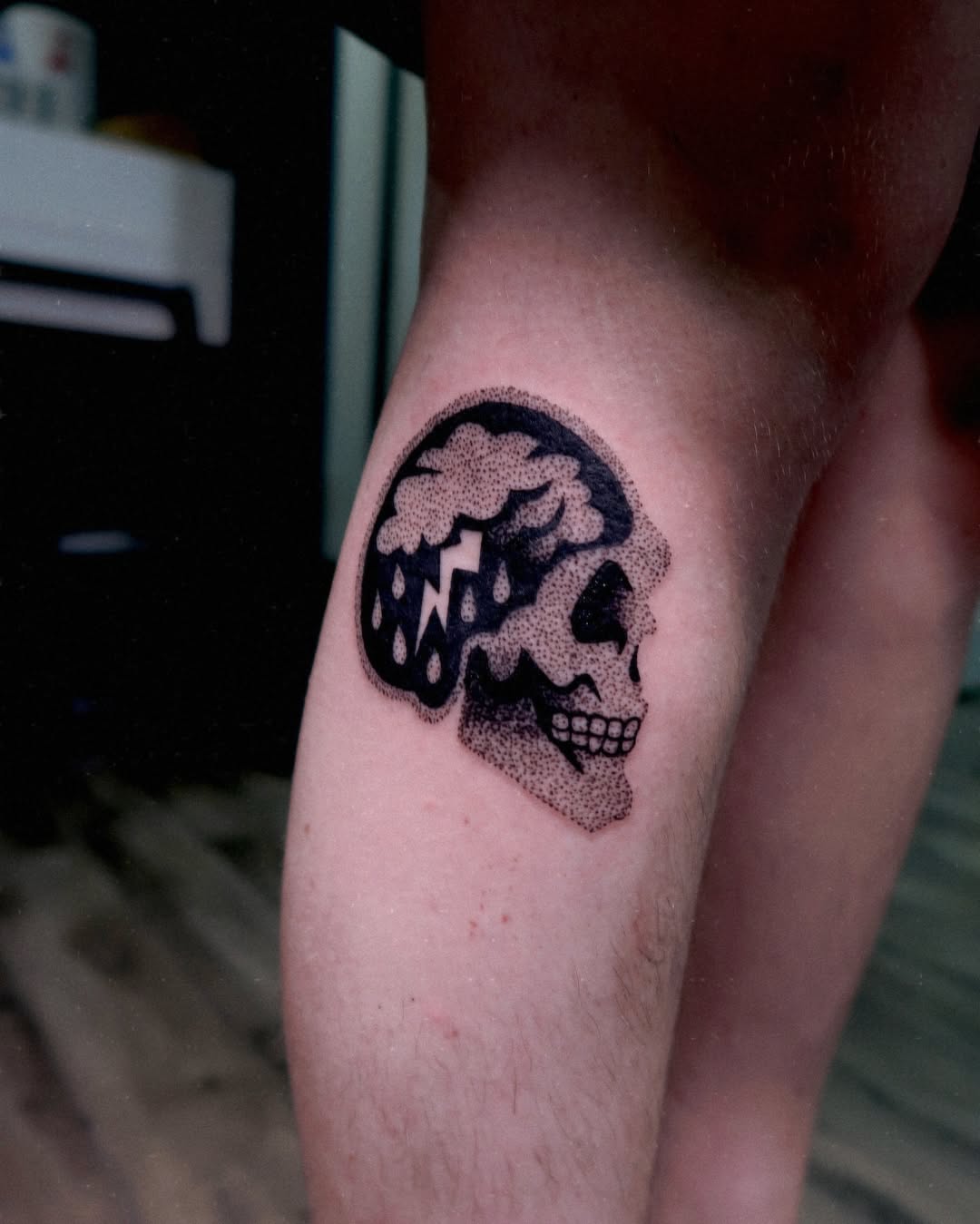 Creative skull tattoo with brain and raindrops