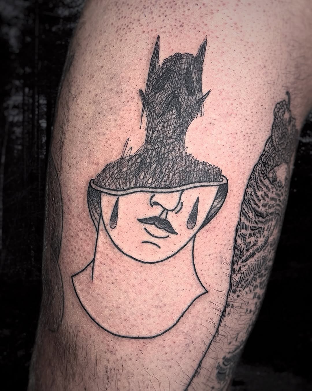 Expressive silhouette tattoo representing emotional struggles