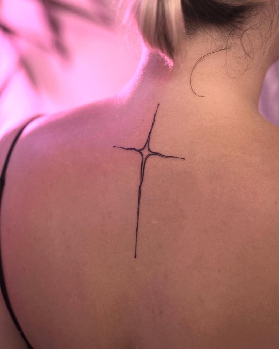 A minimalist star tattoo with a unique design