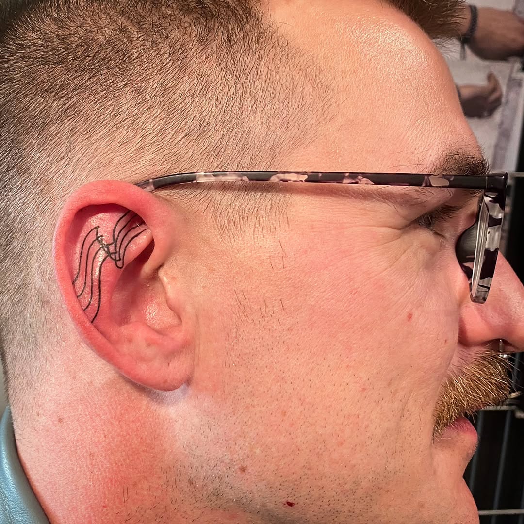 Stylish and Subtle Ear Tattoo Design