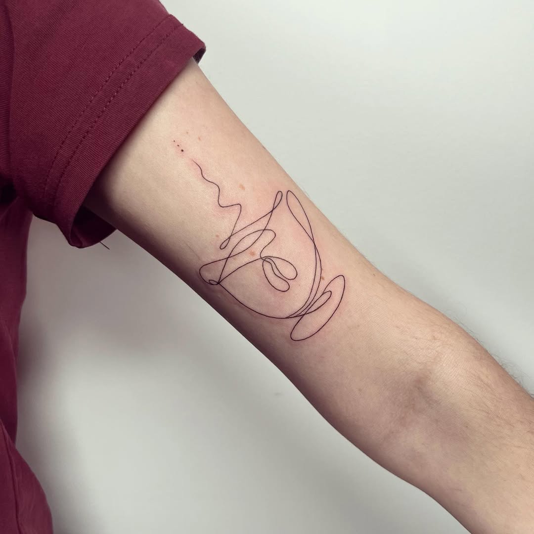 Unique minimalist coffee cup line art tattoo