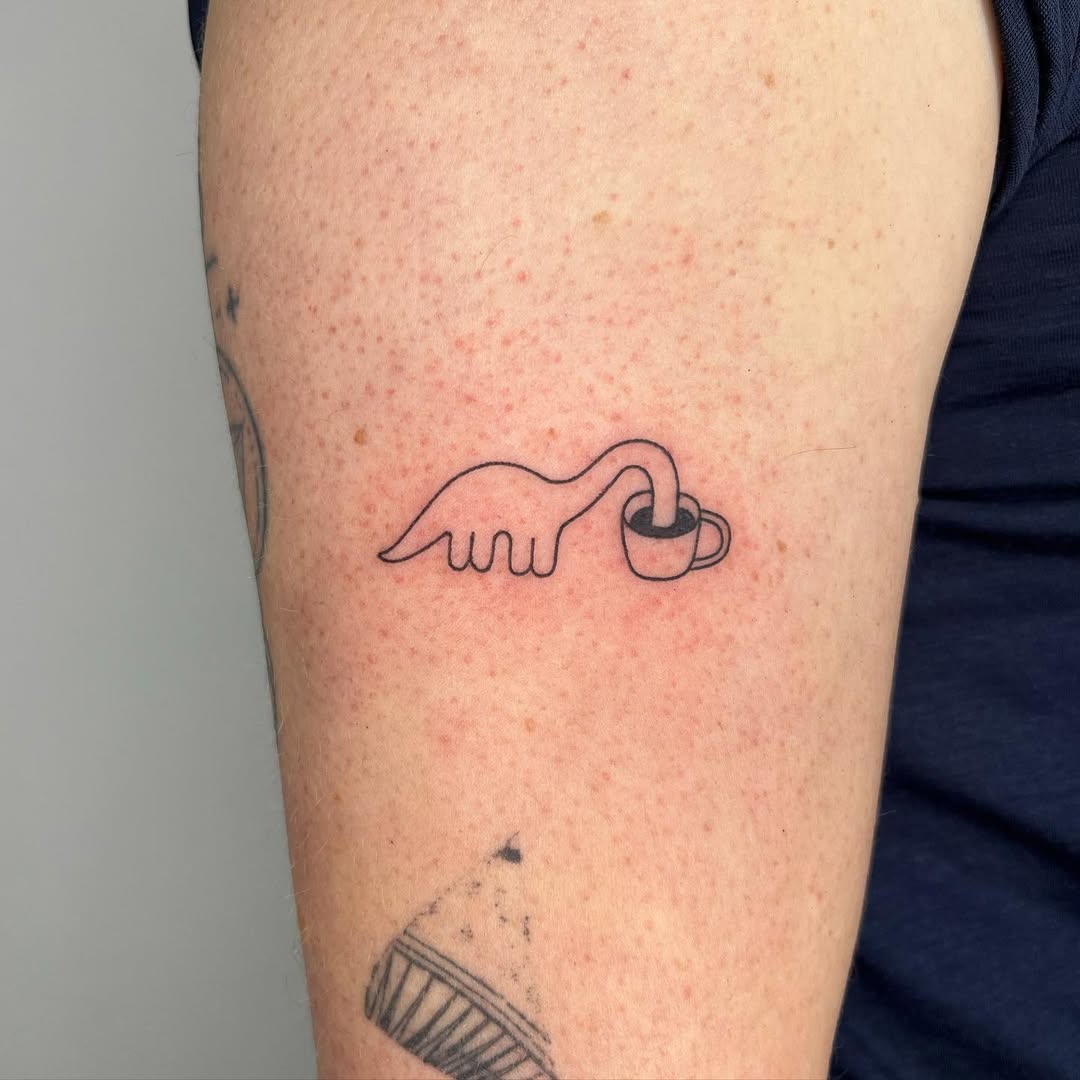 Whimsical minimalist coffee cup tattoo design