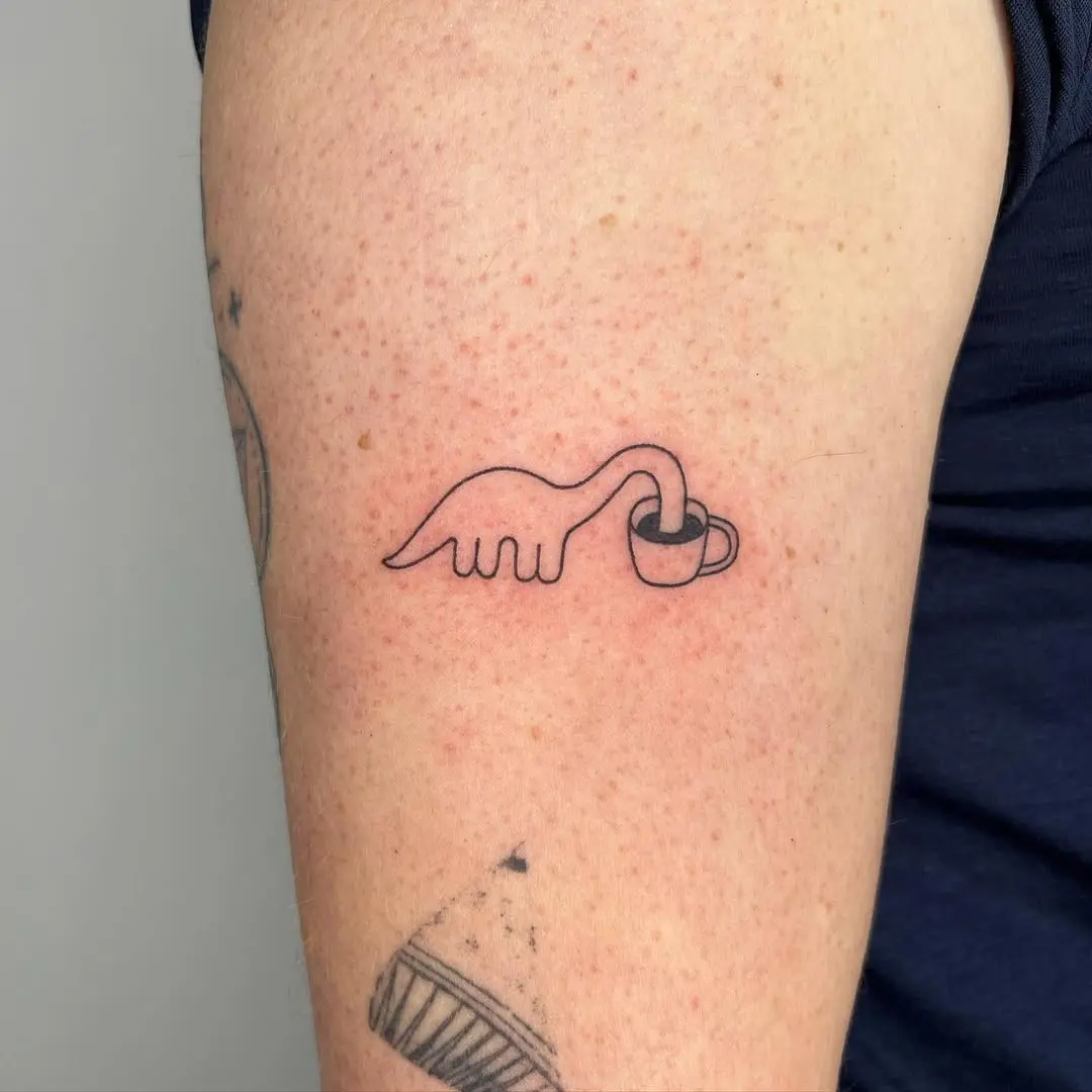 Whimsical minimalist coffee cup tattoo design