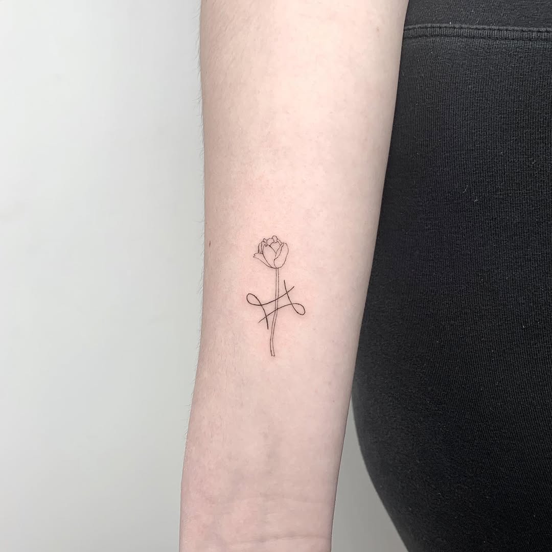 Elegant Minimalist Gemini-Inspired Rose Tattoo