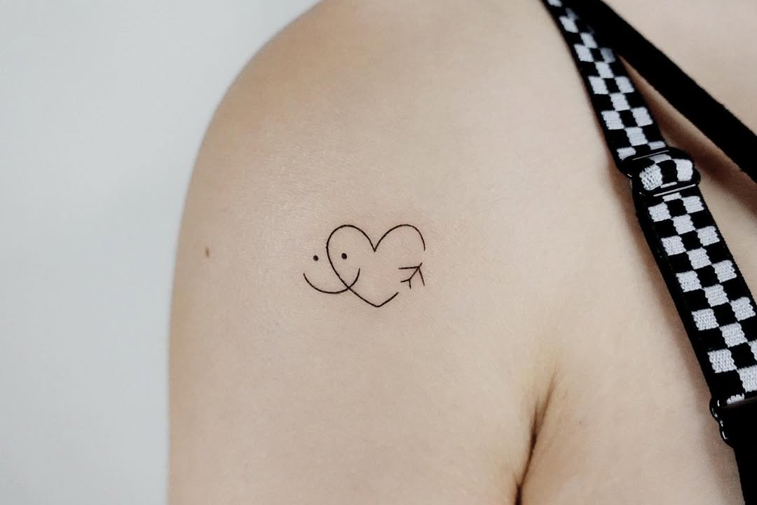 Charming minimalist heart and smiley tattoo design