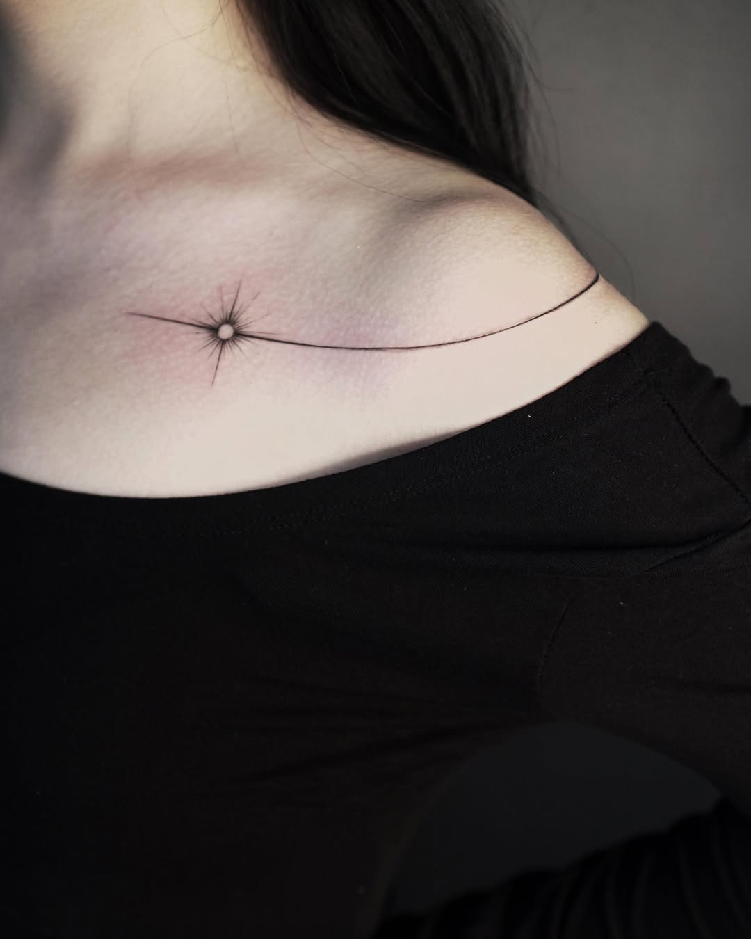 Elegant star tattoo on shoulder design