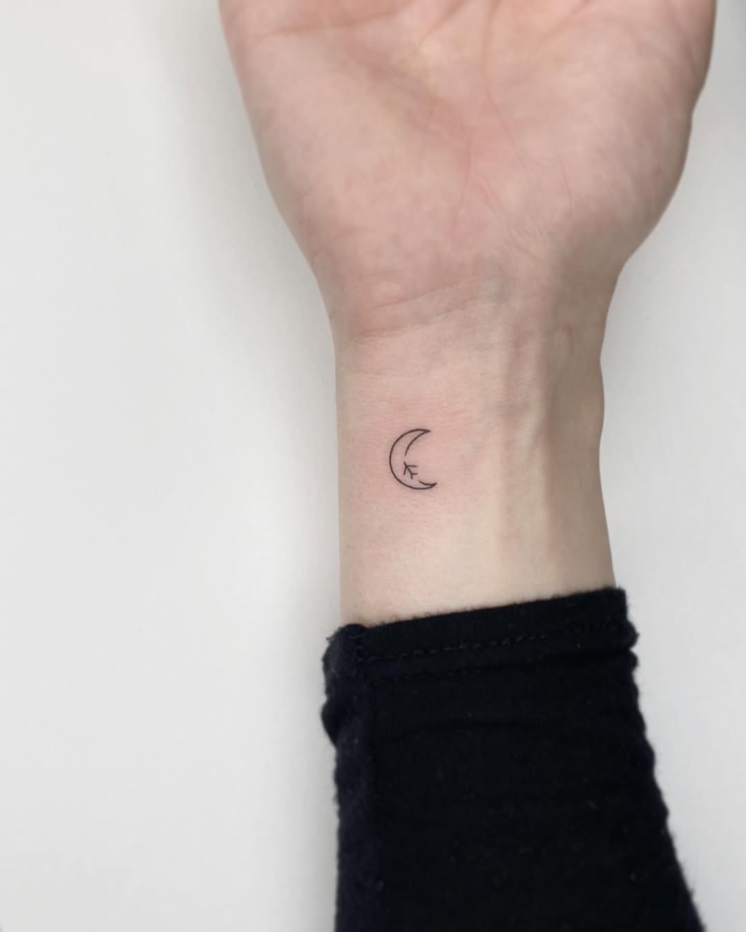 Charming Minimalist Moon Tattoo on Wrist