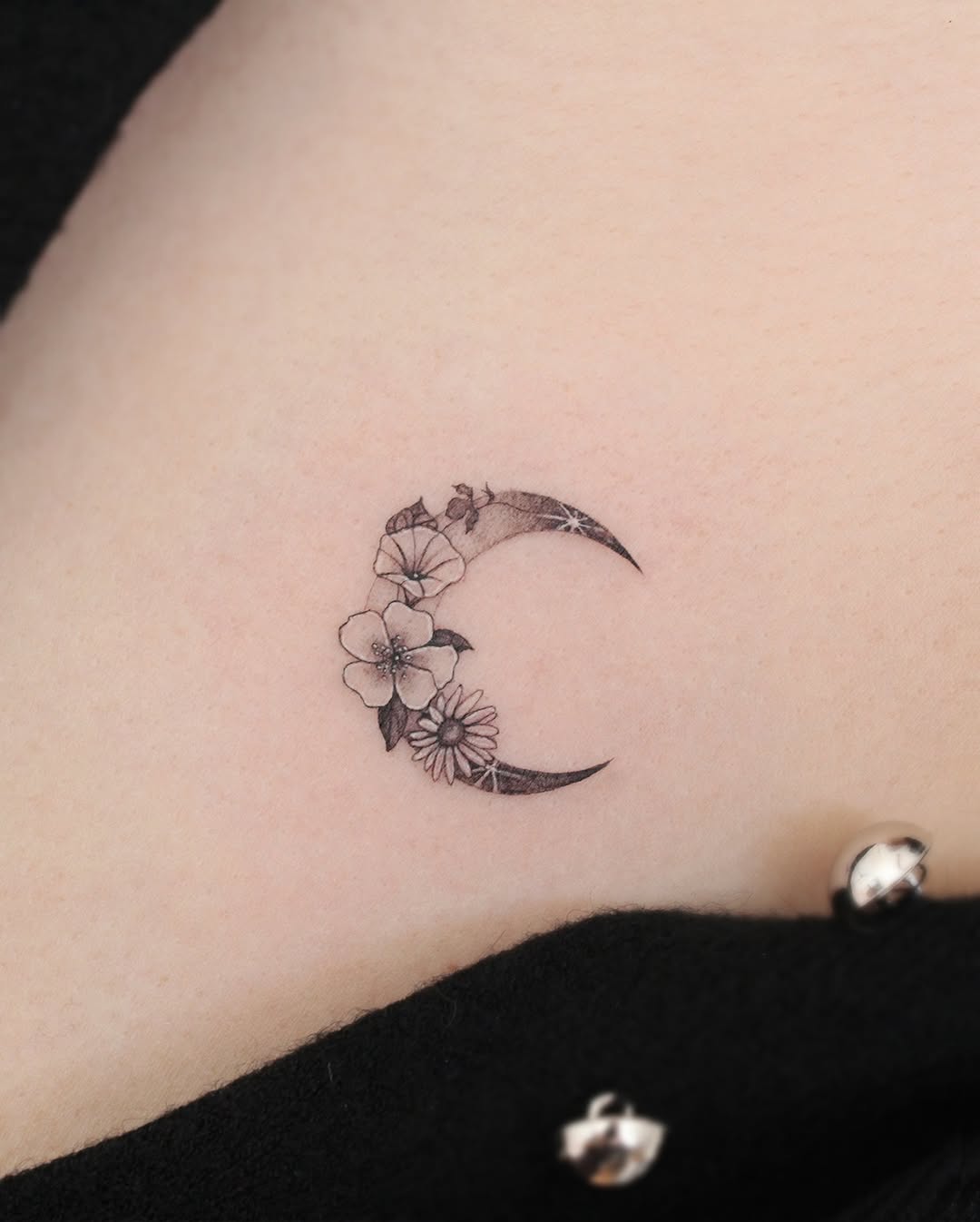 Floral crescent moon tattoo design for elegance