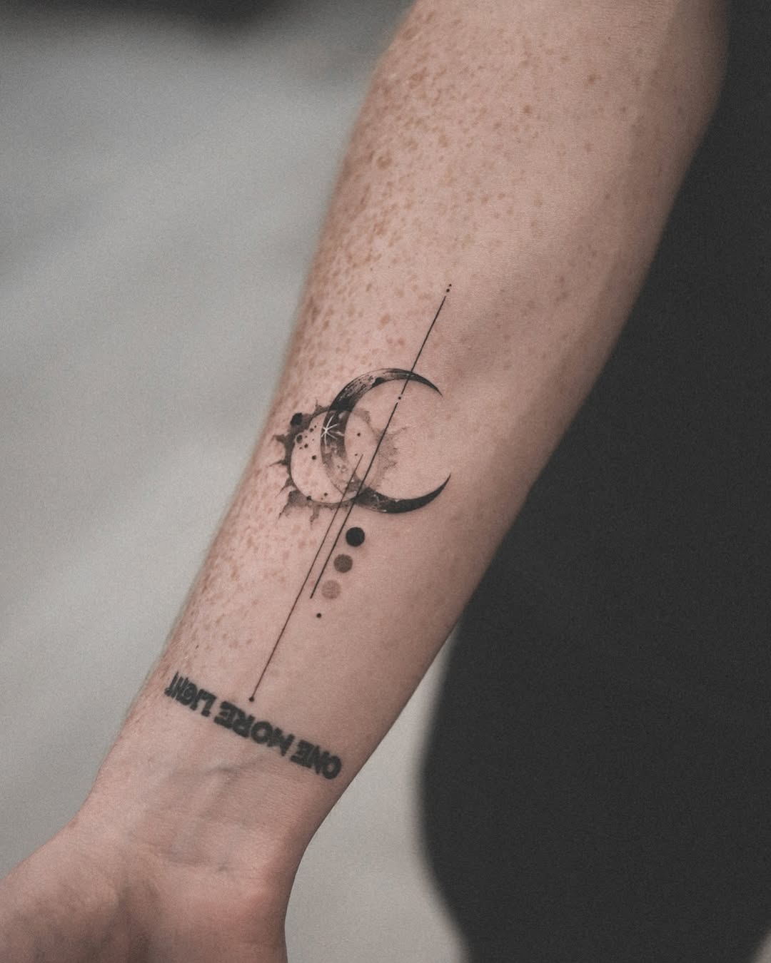 Stylish moon phase tattoo with sun accents