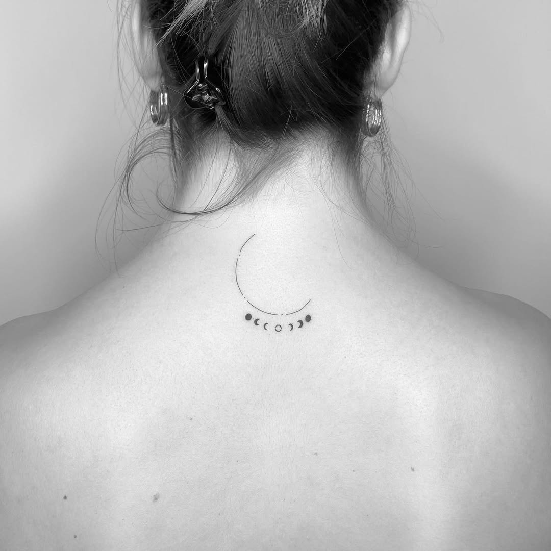 Minimalist moon phase tattoo on the back