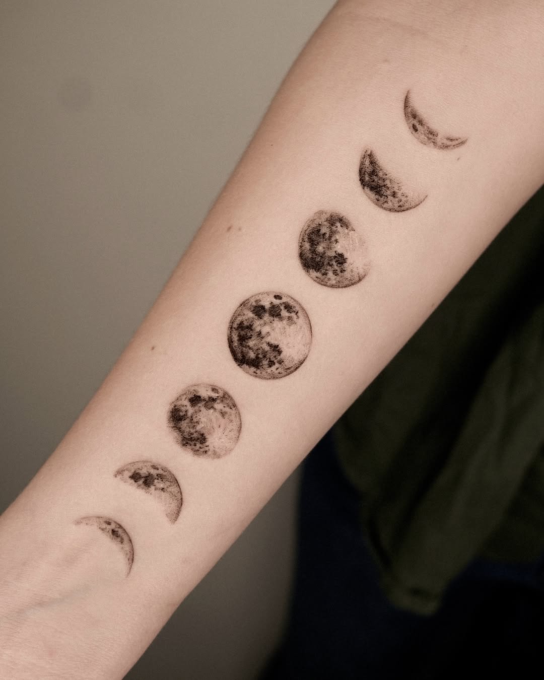 Stunning moon phases tattoo on the forearm