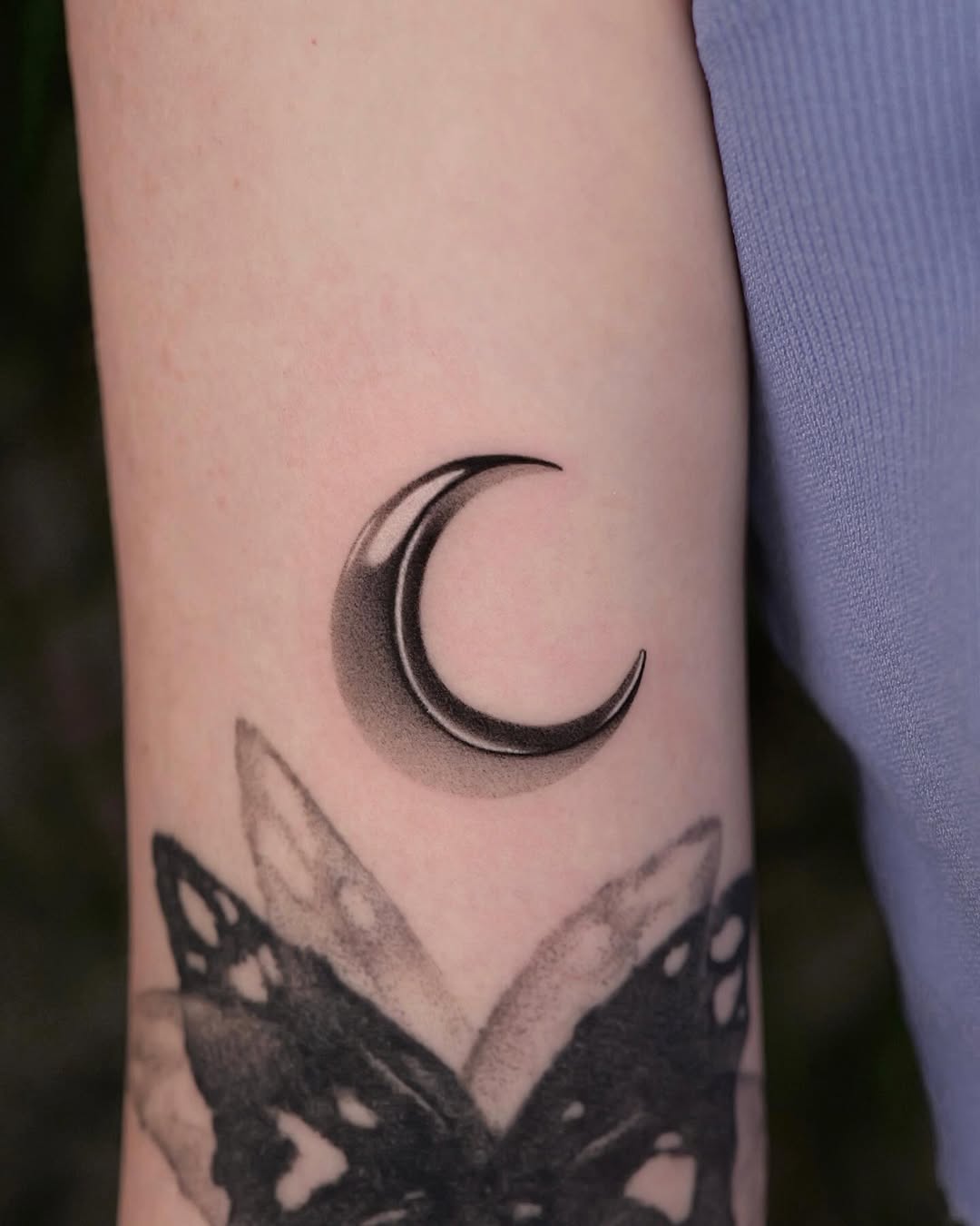 Elegant crescent moon tattoo with shading detail