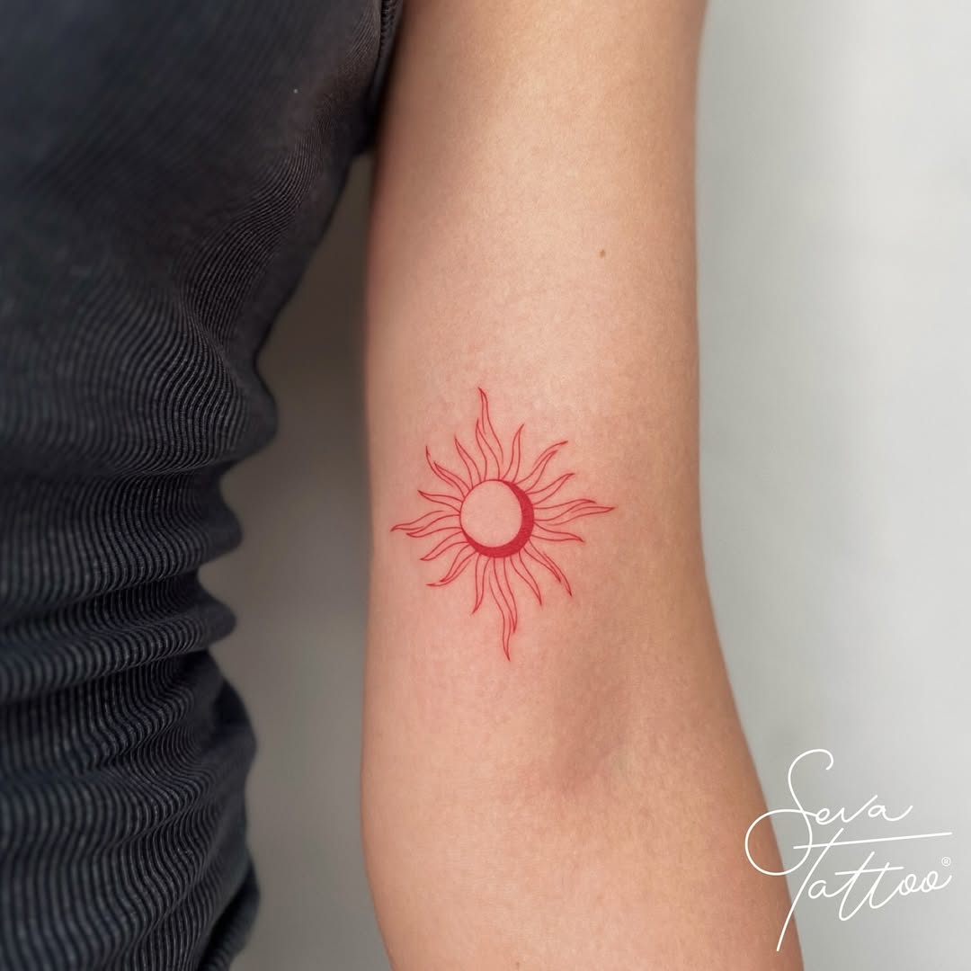 Radiant sun tattoo symbolizes light and energy