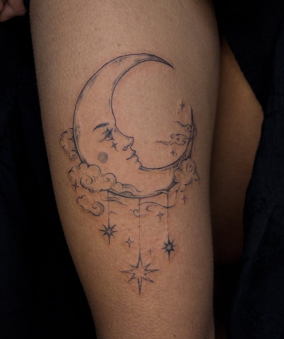 Elegant Moon Tattoo with Serene Facial Elements