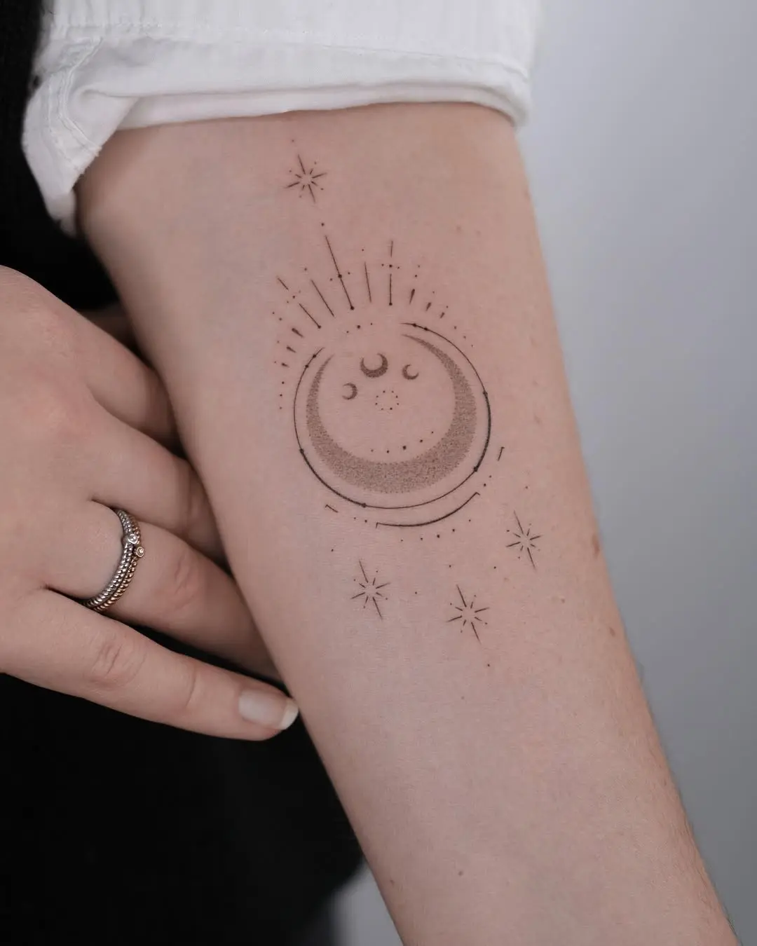 Whimsical moon tattoo with star details