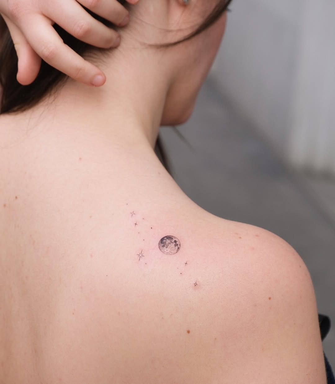 Stunning moon and star tattoo on shoulder