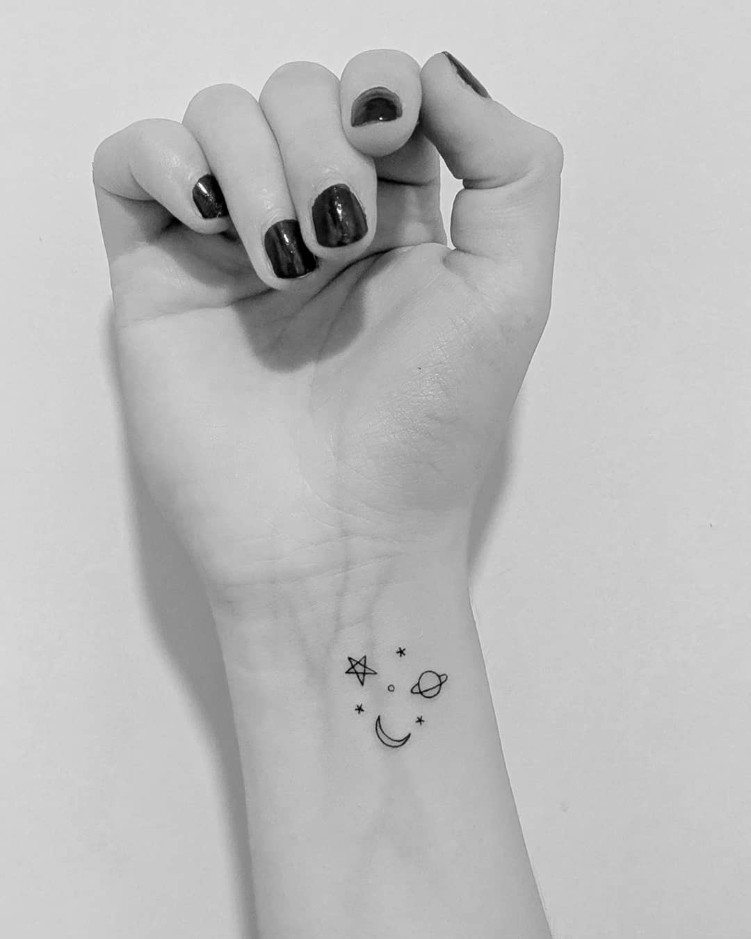 Charming simple moon and stars tattoo design