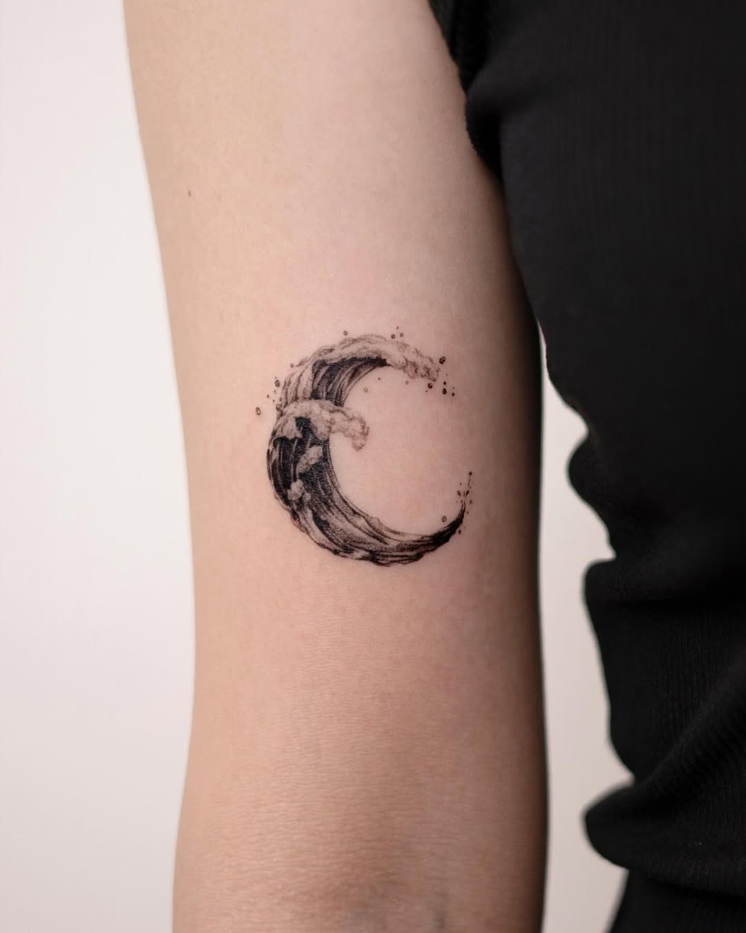 Fluid wave meets lunar elegance in ink