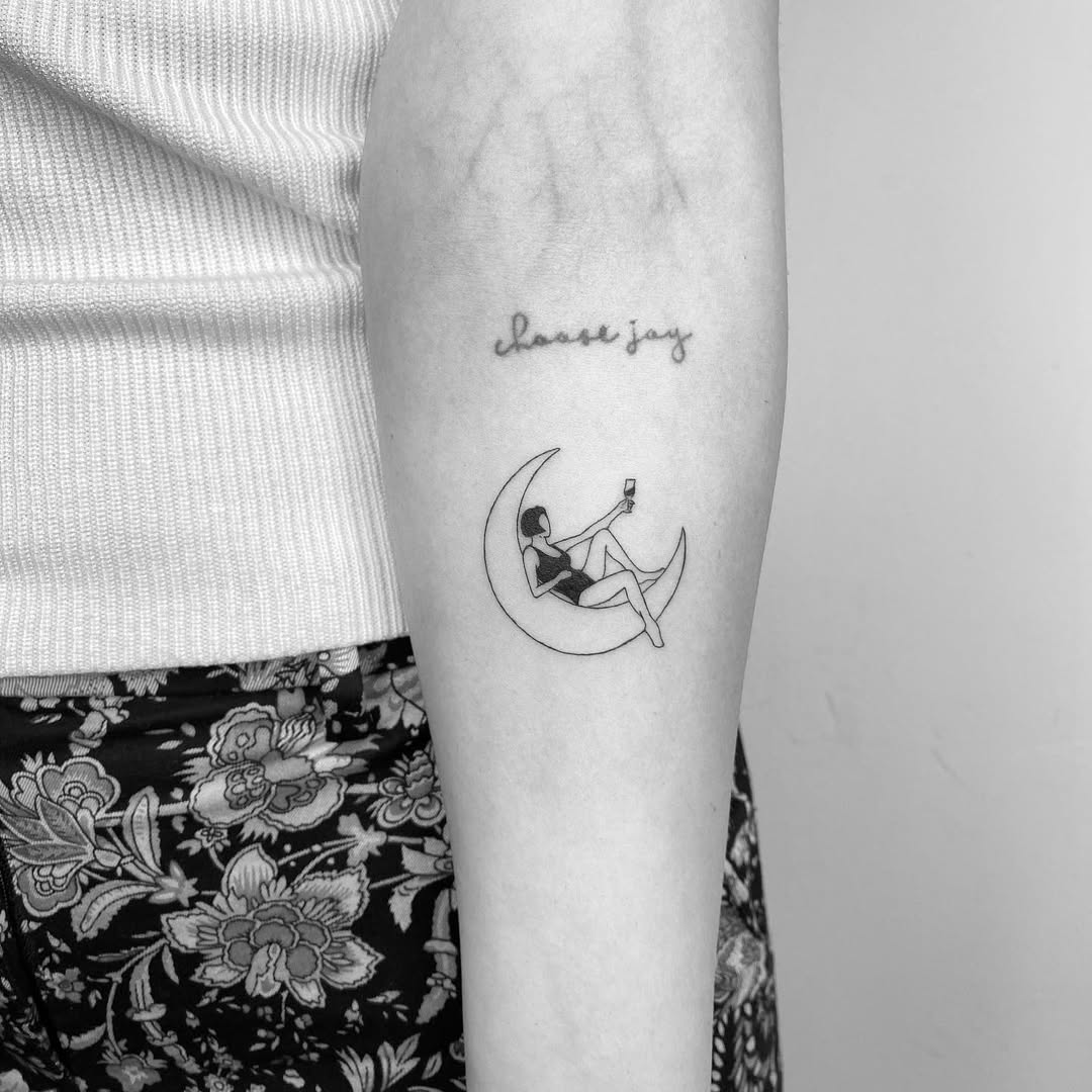 Stylish lunar tattoo with a lounging figure