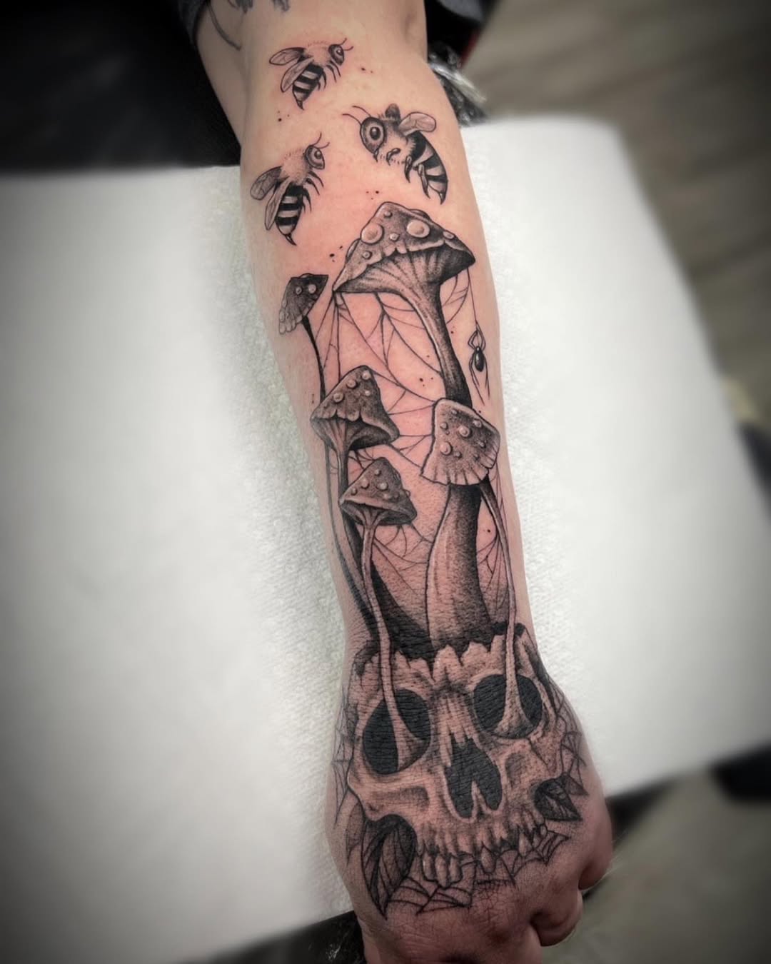 Unique skull and mushroom tattoo design