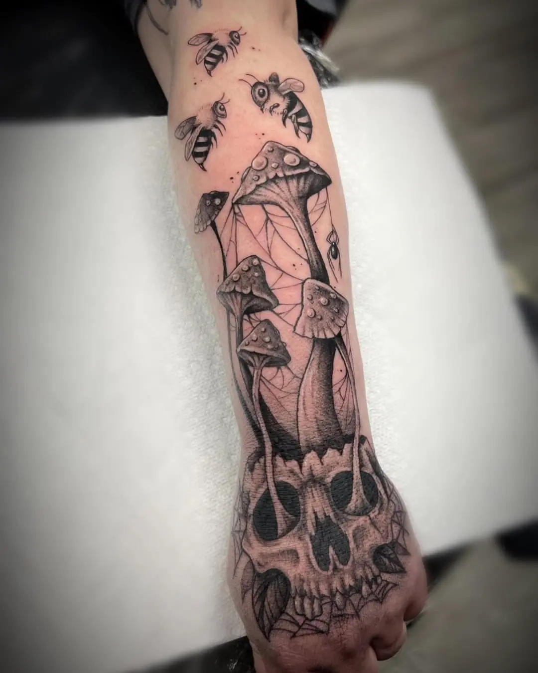 Unique skull and mushroom tattoo design
