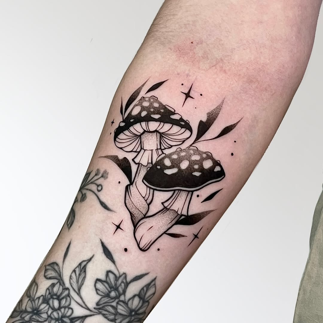 Intricate black ink mushroom tattoo design