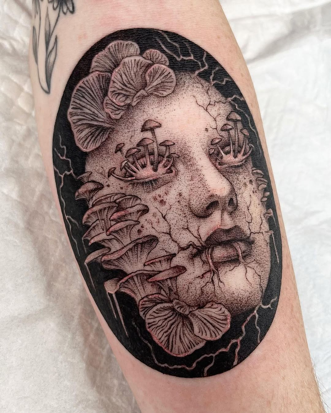 Intricate and surreal mushroom face tattoo design