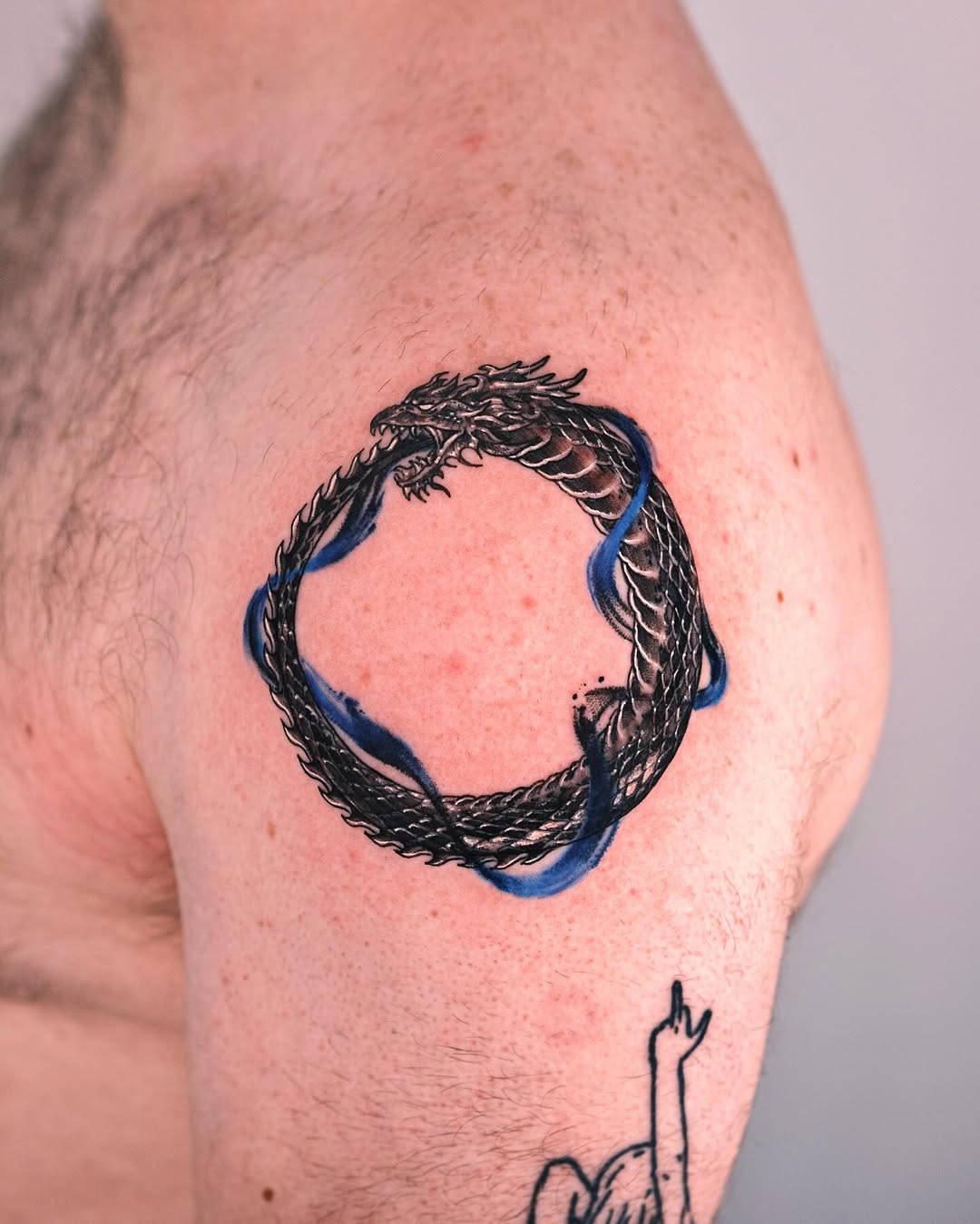 Stunning dragon ouroboros tattoo design