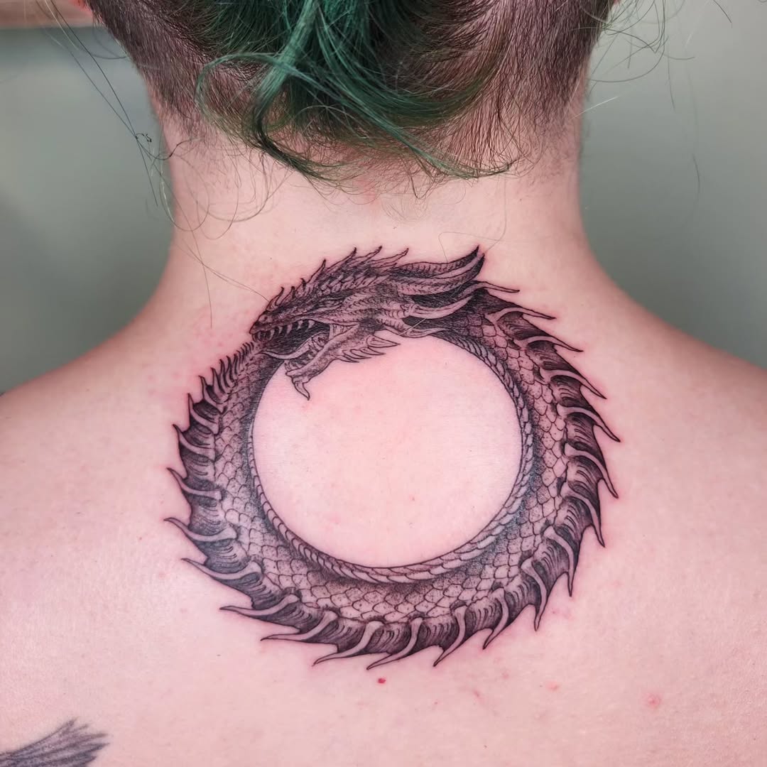 Intricate ouroboros tattoo showcasing timeless cycle