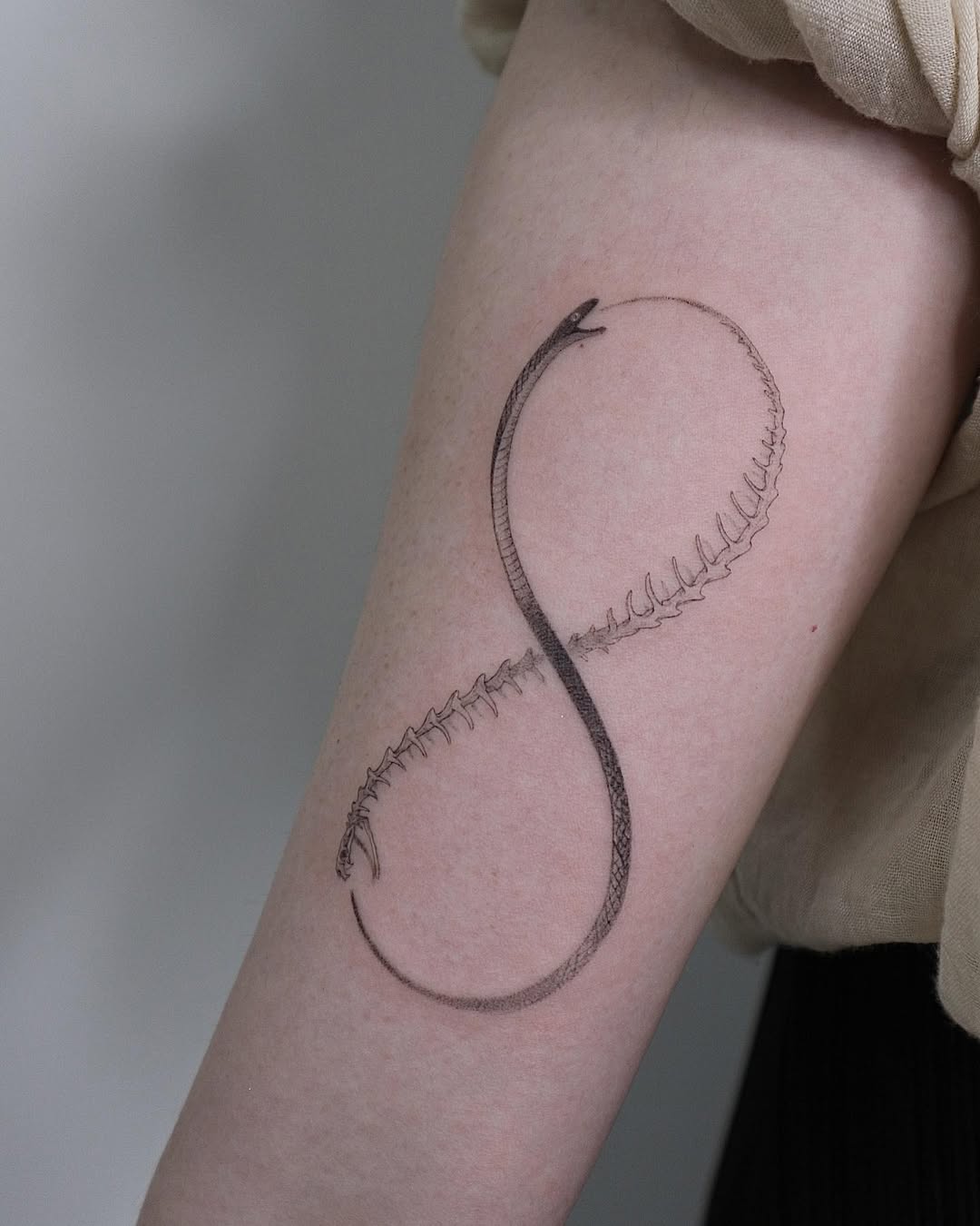 Elegant ouroboros tattoo symbolizing eternity