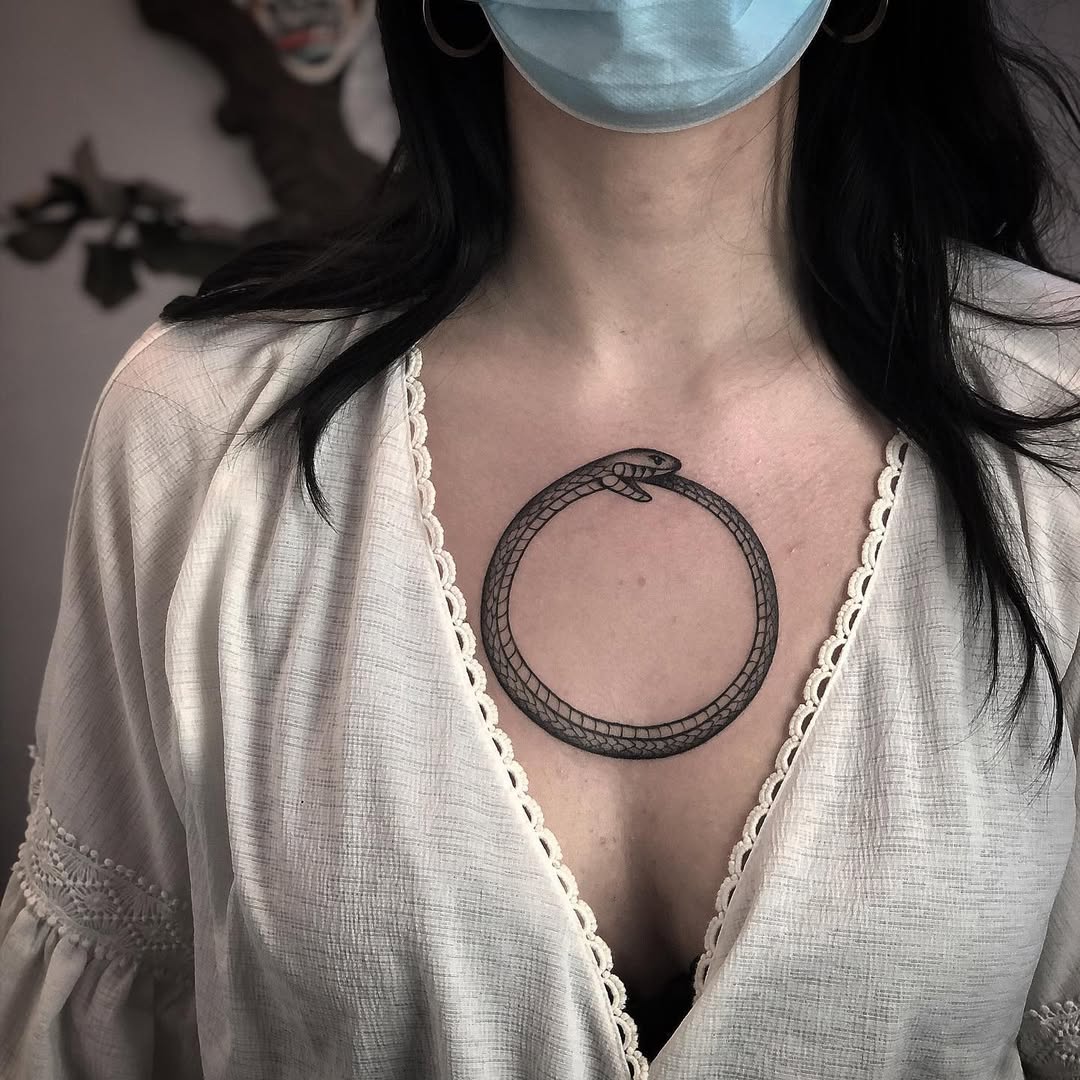 Striking Ouroboros Tattoo on the Chest