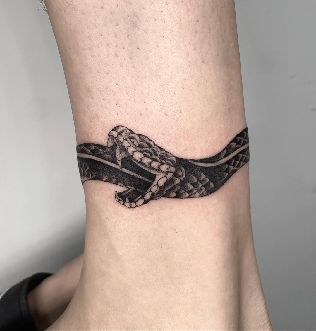 Intricate Snake Ouroboros Tattoo on Ankle