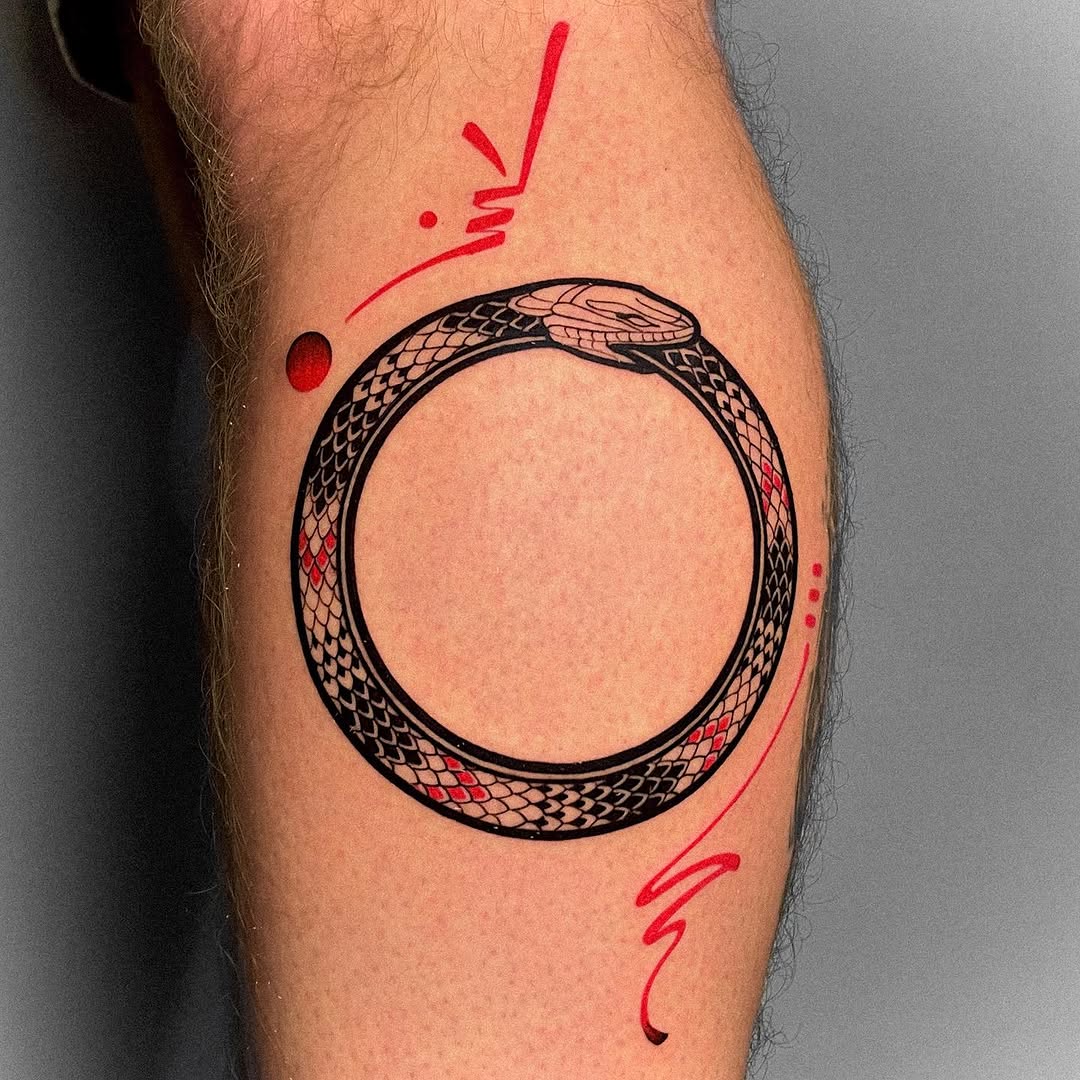 Stylish ouroboros tattoo with vibrant accents