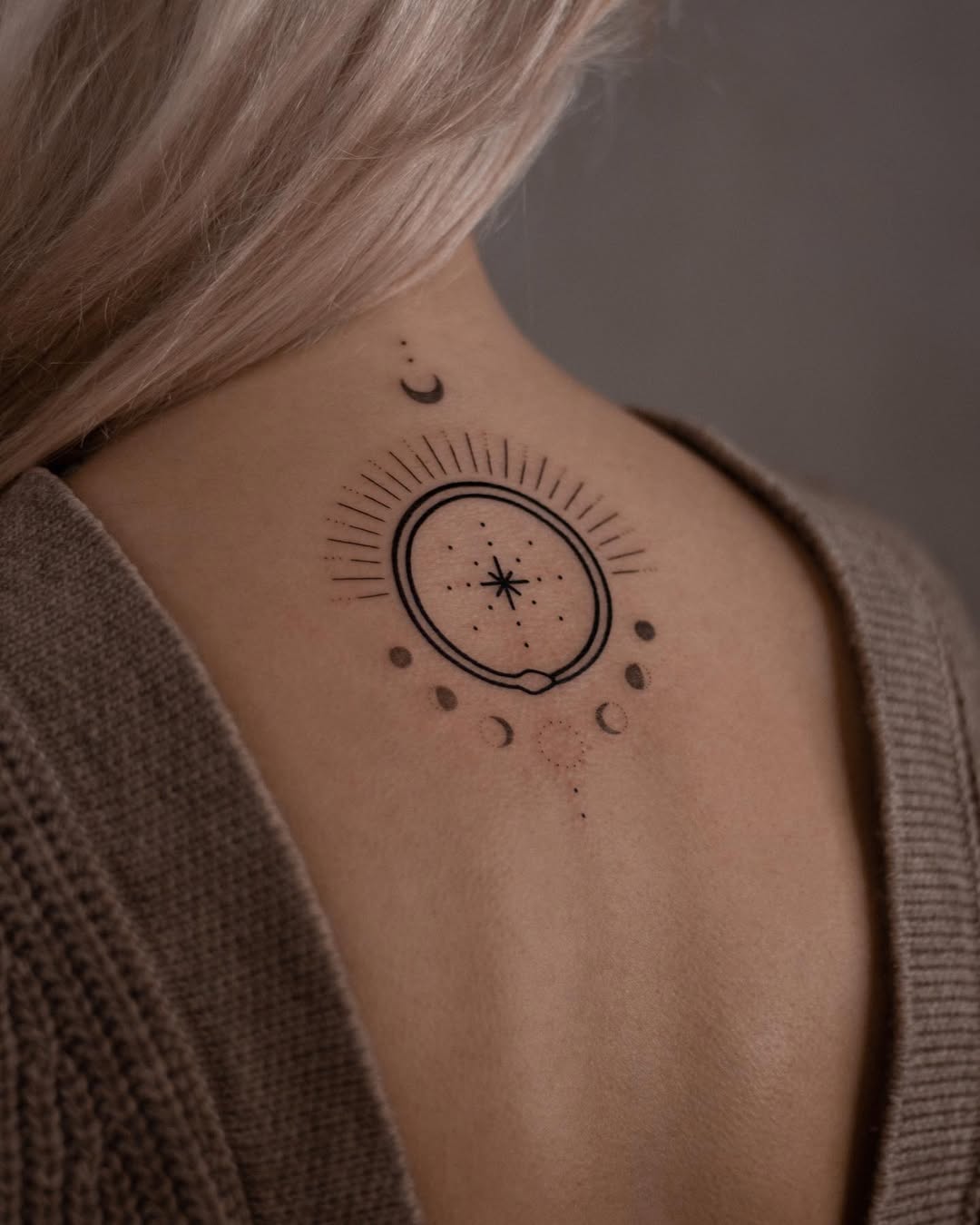 Unique ouroboros tattoo with celestial elements