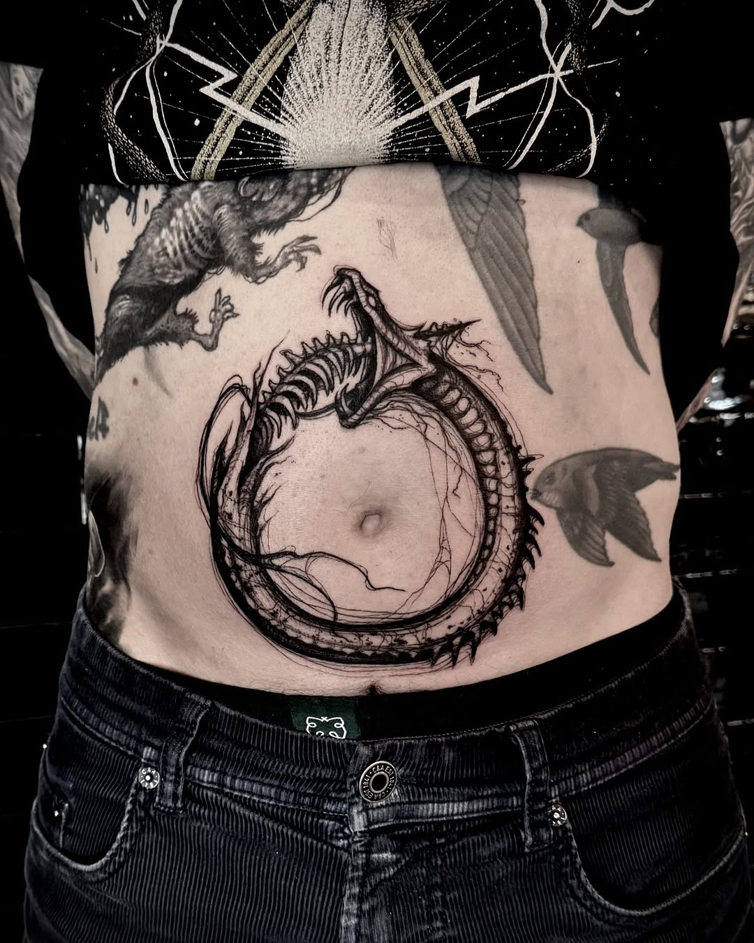 Stunning ouroboros tattoo on belly