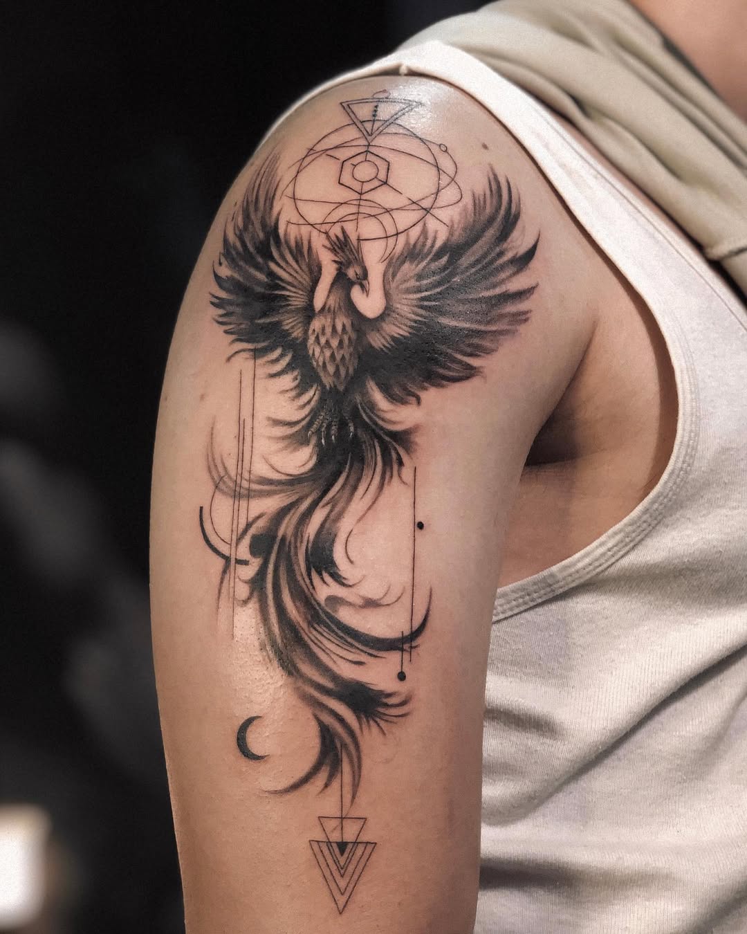 Majestic black phoenix tattoo design on arm