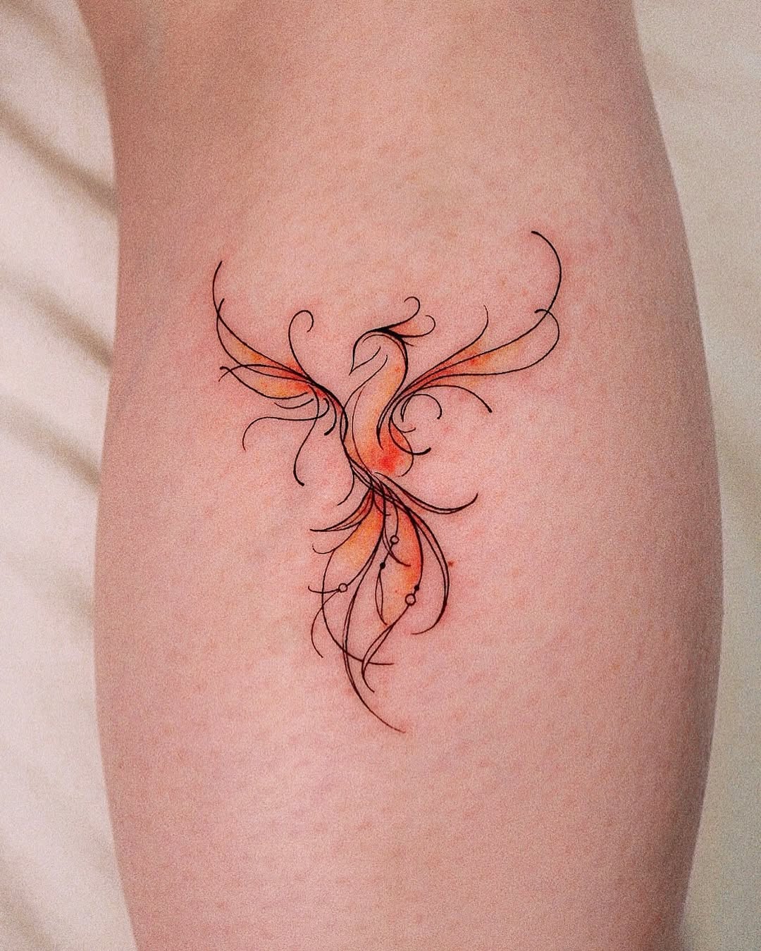 Artistic Phoenix Tattoo with Flowing Lines