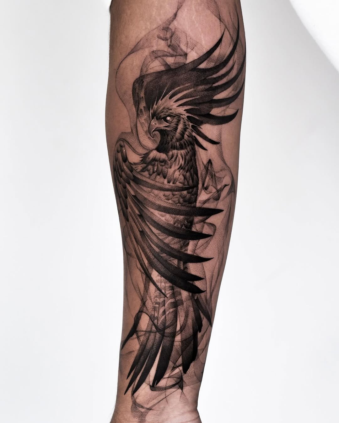 Stunning black-and-gray phoenix tattoo design